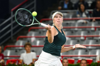 Tauson lupta prin caldura intens pentru a castiga un meci provocator in Cincinnati